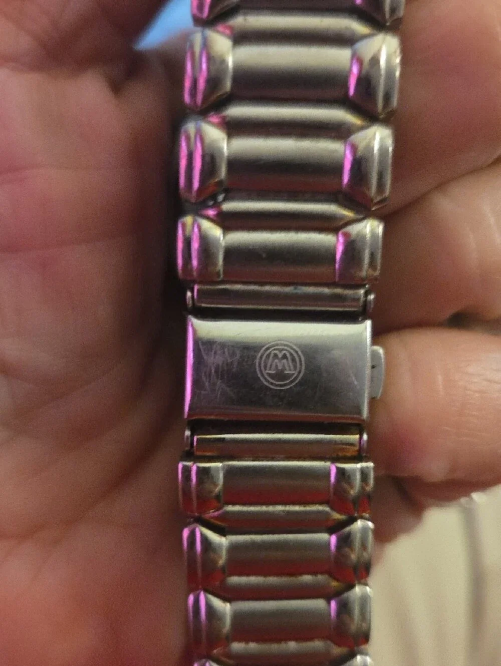 Movado Black Dial Watch with Gold Hands and Dot